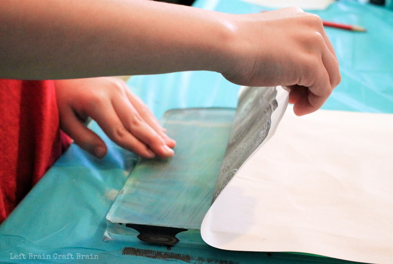 Carefully pull back your work from the gelli printing materials to create a screen printing like art work.