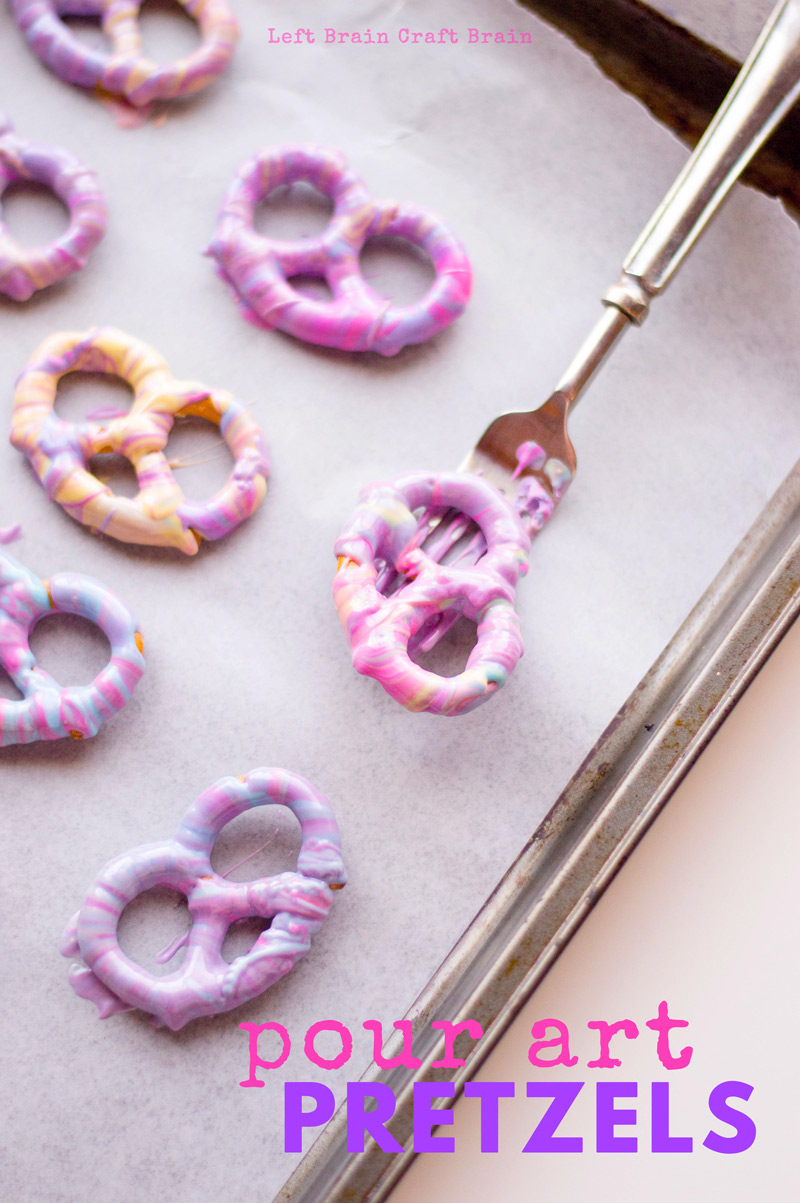 These colorful pour art white chocolate covered pretzels are a beautiful addition to any cookie tray. Perfect for Christmas, unicorn birthday parties, or any special occasion. Candy melts make them easy.
