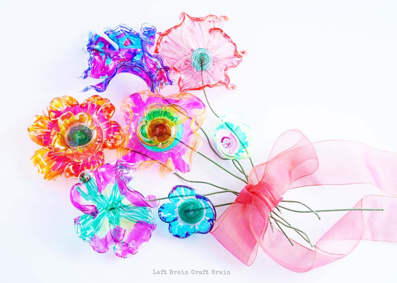 colorful recycled plastic flowers bouquet with ribbon