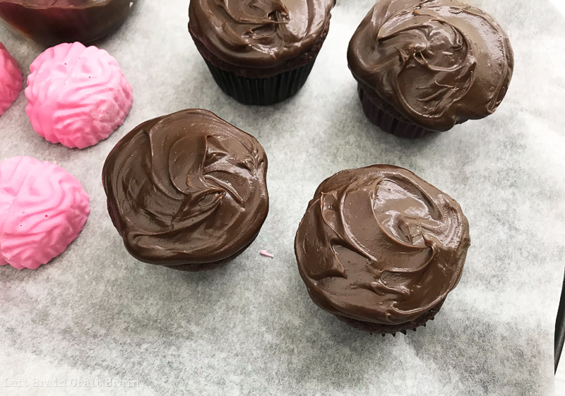 frost the cupcakes with chocolate frosting