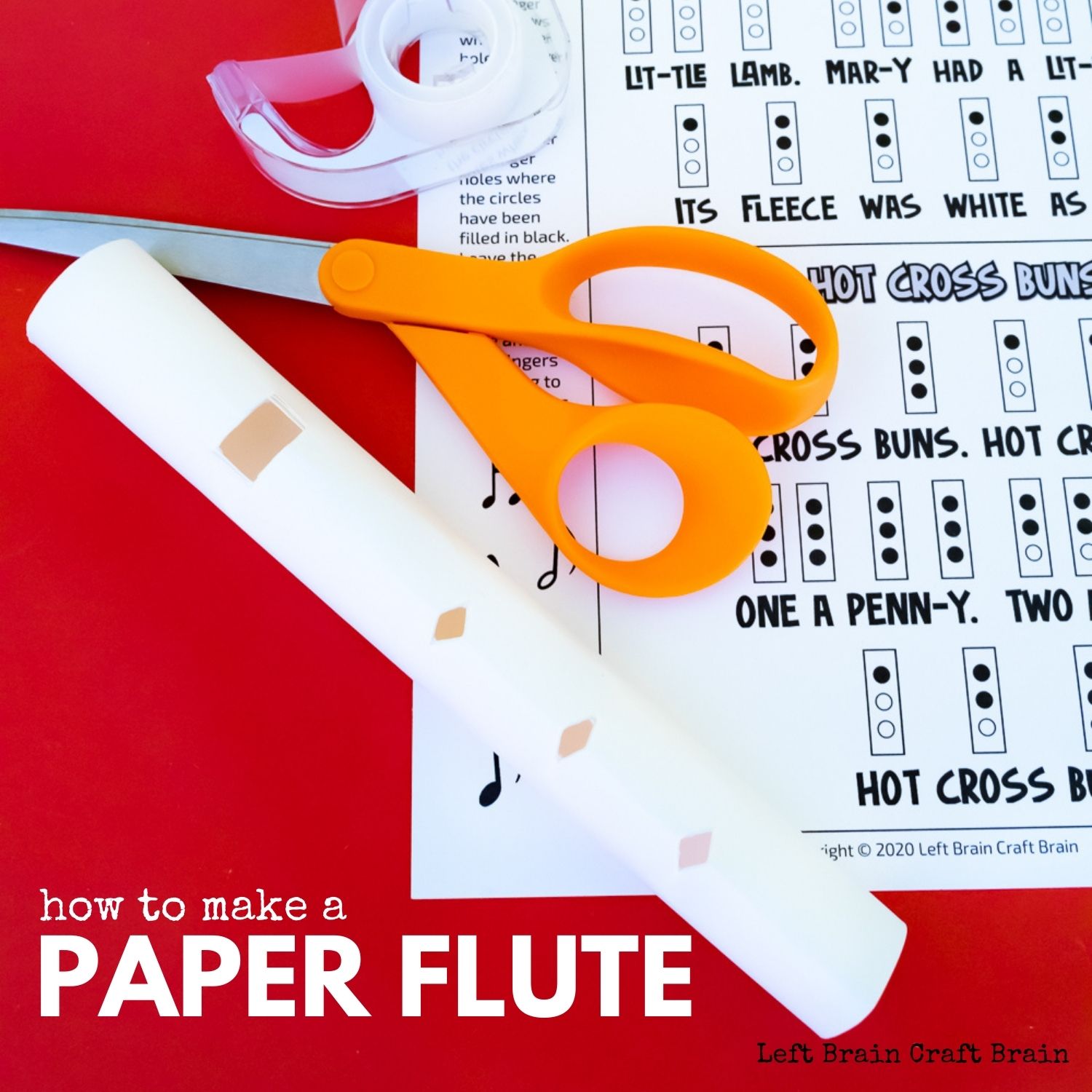 Paper flute, printed music, clear tape, orange-handled scissors on red background. Text: How to make a Paper Flute and Left Brain Craft Brain