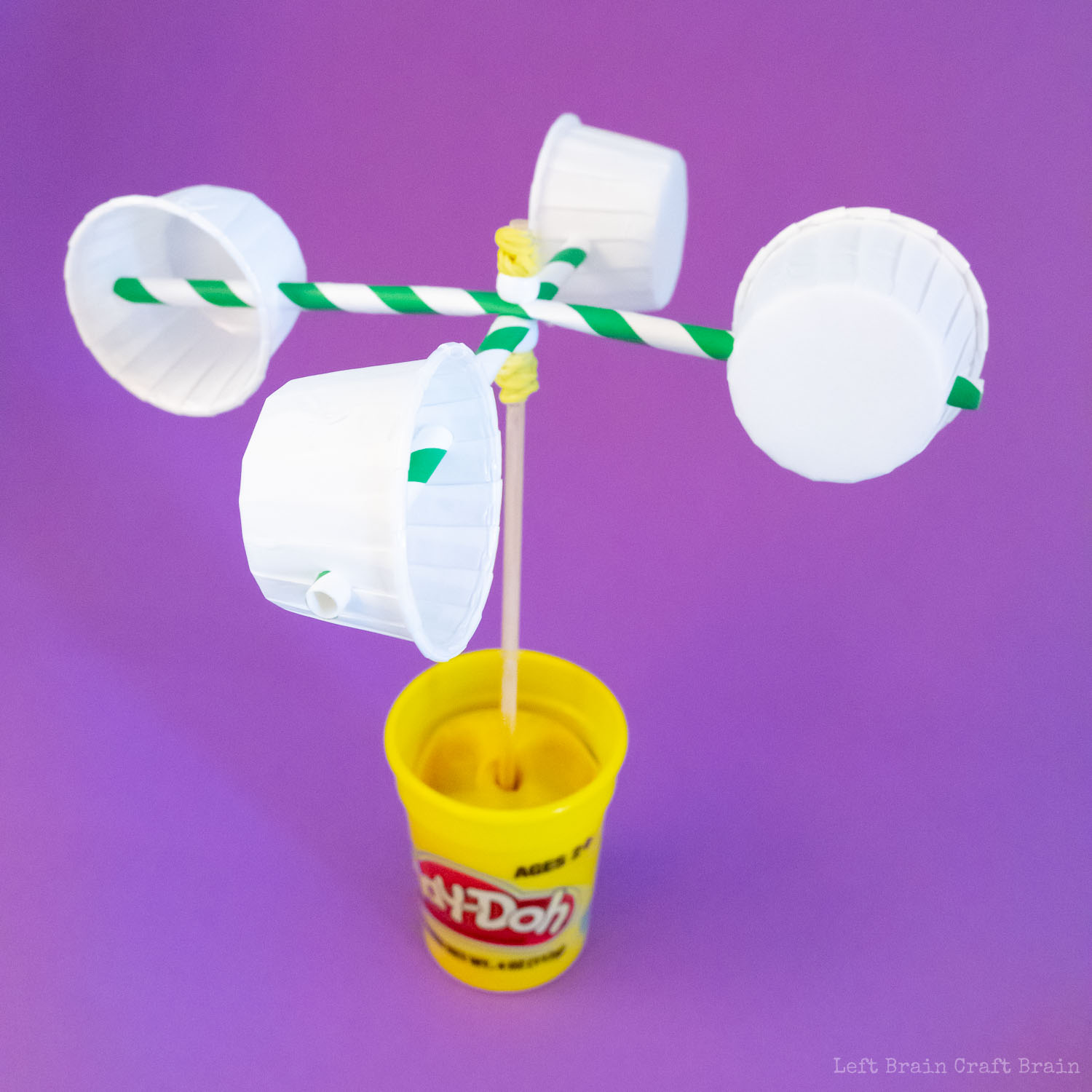 prop anemometer bamboo skewer in playdoh cup on purple background